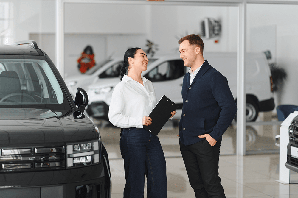 car-sales-man-and-woman-meeting-at-dealership-2026-03-26-10-36-43-utc.png