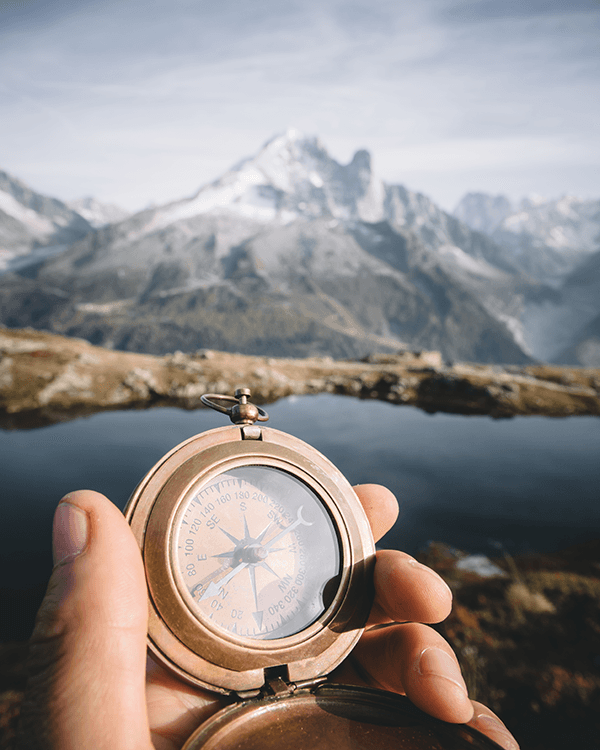 compass-pointing-way-in-scenic-mountain-wilderness-2026-03-19-02-22-10-utc.png