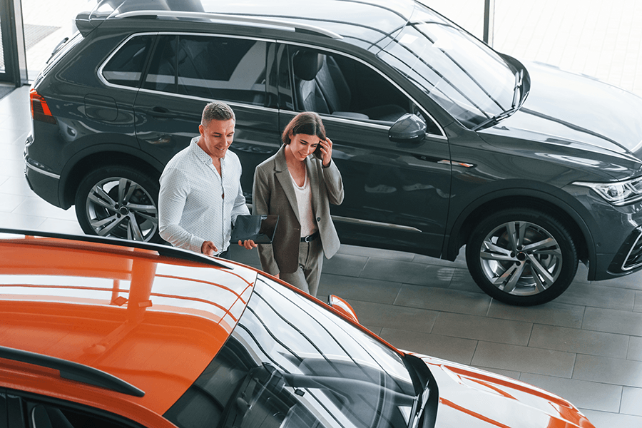 customers-at-car-dealership-consulting-with-salesm-2026-01-09-00-07-04-utc.png