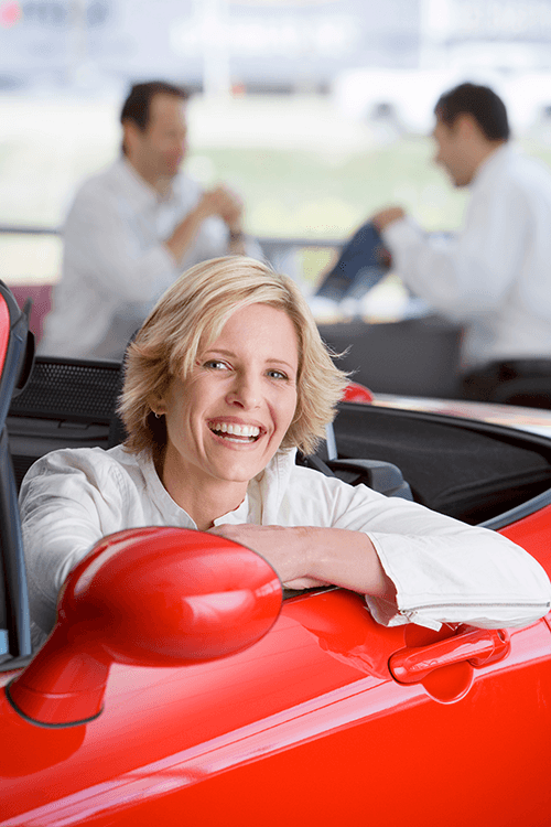 happy-woman-smiling-in-a-red-convertible-car-2026-01-11-08-42-49-utc.png