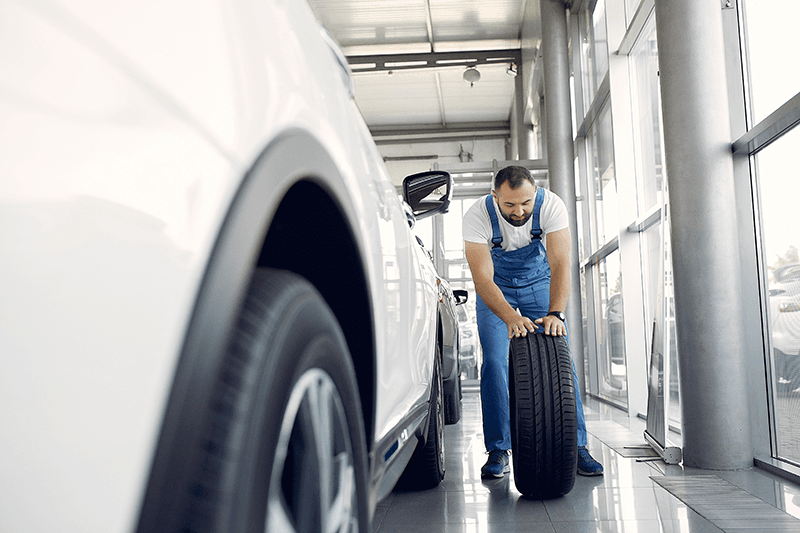 mechanic-in-blue-overalls-changes-car-tire-2026-03-16-04-56-27-utc.png