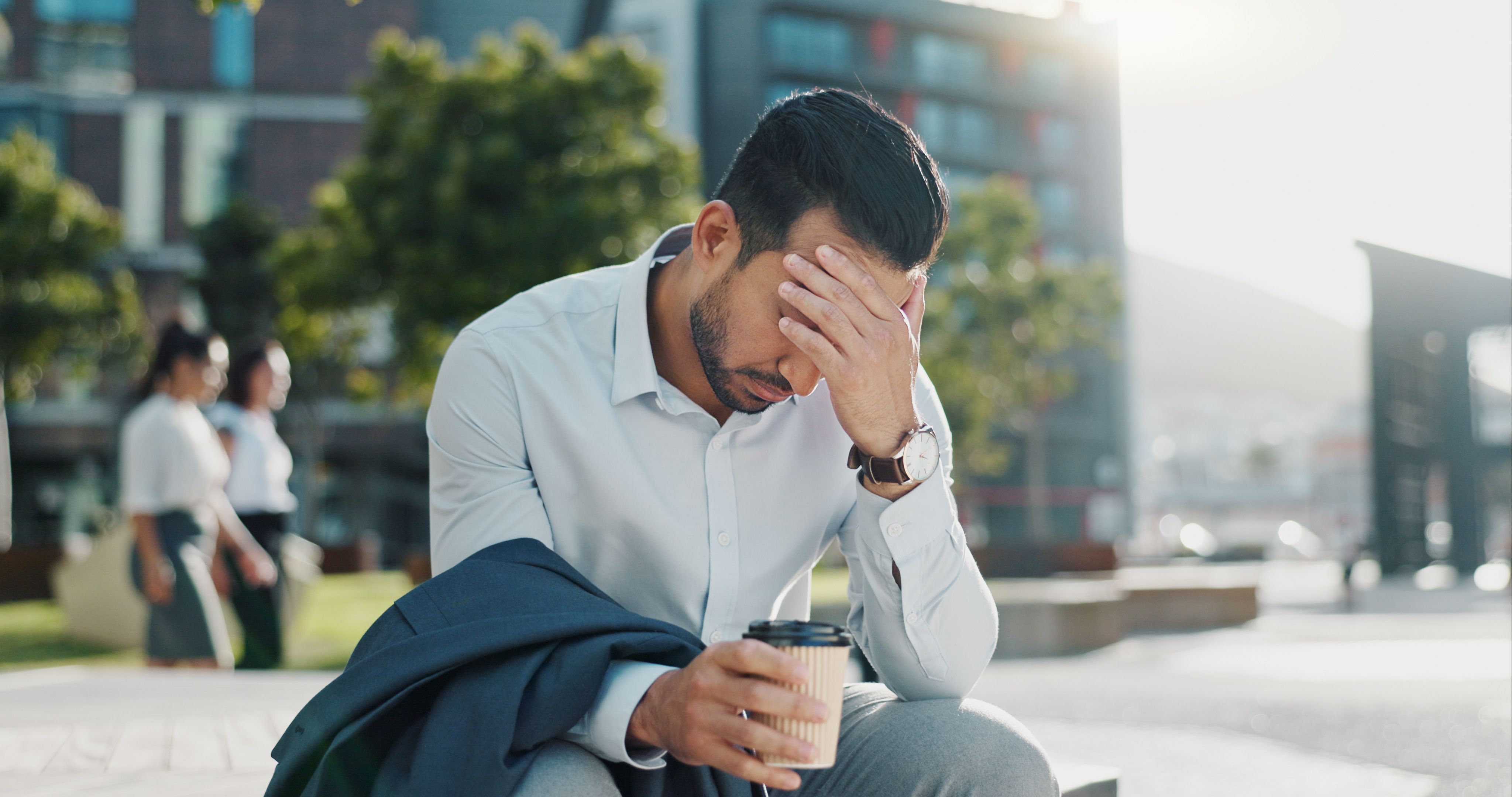 stressed-businessman-sitting-outside-office-buildi-2026-09-22-05-42-23-utc.jpg